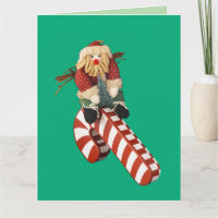 Weihnachtsmann spielt auf einer Zuckerstangenrutsc