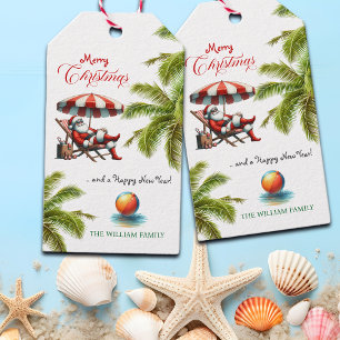 Weihnachtsmann unter einem Strandsonnenschirm Geschenkanhänger