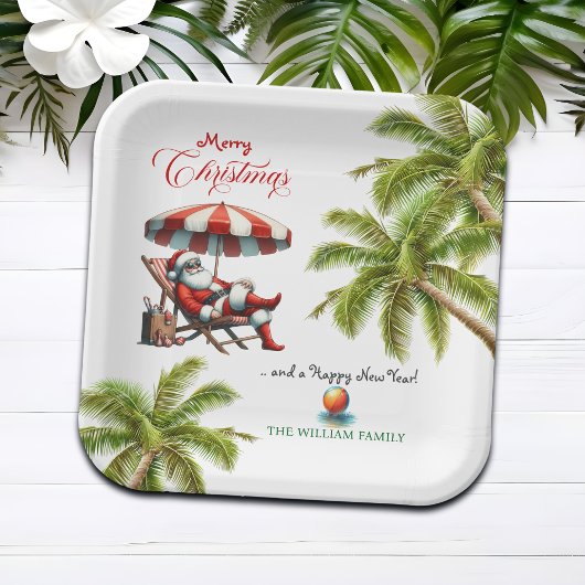 Weihnachtsmann unter einem Strandsonnenschirm Pappteller