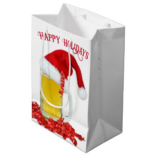 Weihnachtsmannmütze auf Bier-Tasse Mittlere Geschenktüte