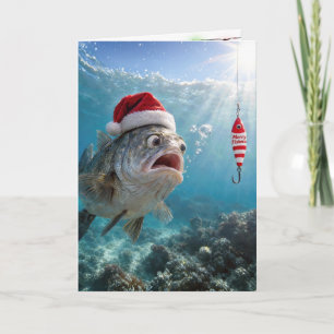 Weihnachtsmannmütze auf einem großen Fisch Feiertagskarte