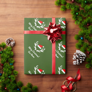 Weihnachtsmannmütze und vintage Rentiergeweih Weih Geschenkpapier