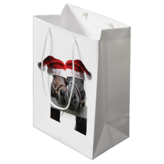 Weihnachtspferde mit Weihnachtsmann Hats auf Mittlere Geschenktüte