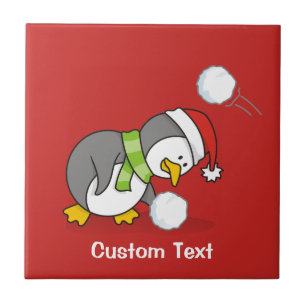 Weihnachtspinguin bekommt eine Schneeball Fliese