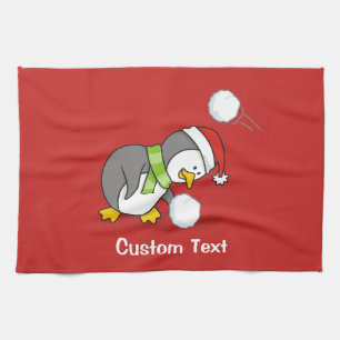 Weihnachtspinguin bekommt eine Schneeball Geschirrtuch