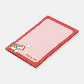 Weihnachtspinguin bekommt eine Schneeball Post-it Klebezettel (angewinkelt)