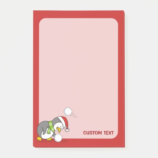 Weihnachtspinguin bekommt eine Schneeball Post-it Klebezettel (Vorderseite)