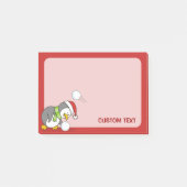 Weihnachtspinguin bekommt eine Schneeball Post-it Klebezettel (Vorderseite)