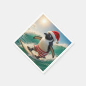 Weihnachtspinguin, der auf einer Meereswelle surft Serviette (Ecke)