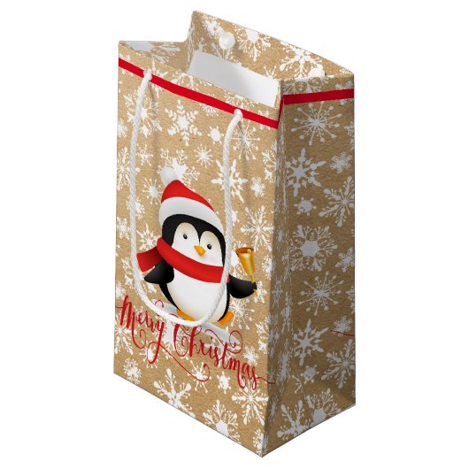 Weihnachtspinguin mit Glocke auf Papiertüte ausseh Kleine Geschenktüte (Vorderseite Schrägansicht)