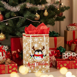 Weihnachtspinguin mit Lichtern auf Papiertüte auss Kleine Geschenktüte