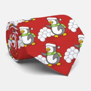 Weihnachtspinguin mit Schneebälle schwingen Krawatte