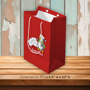 Weihnachtspinguin mit Schneebälle schwingen Mittlere Geschenktüte
