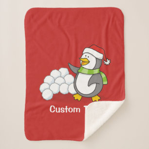 Weihnachtspinguin mit Schneebälle schwingen Sherpadecke
