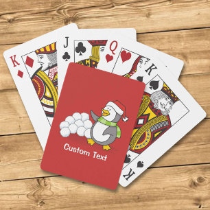 Weihnachtspinguin mit Schneebälle schwingen Spielkarten