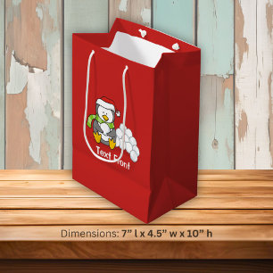 Weihnachtspinguin sitzend mit Schneebälle Mittlere Geschenktüte