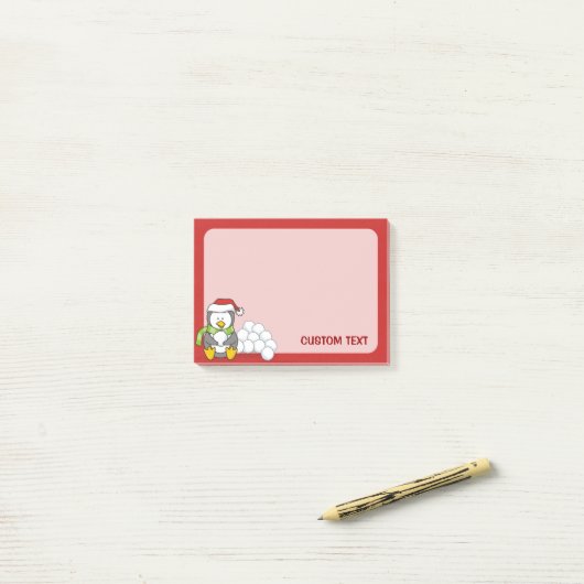 Weihnachtspinguin sitzend mit Schneebälle Post-it Klebezettel (Auf Schreibtisch)