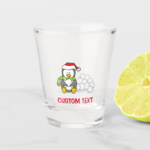 Weihnachtspinguin sitzend mit Schneebälle