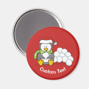 Weihnachtspinguin sitzt mit Schneebällen Magnet