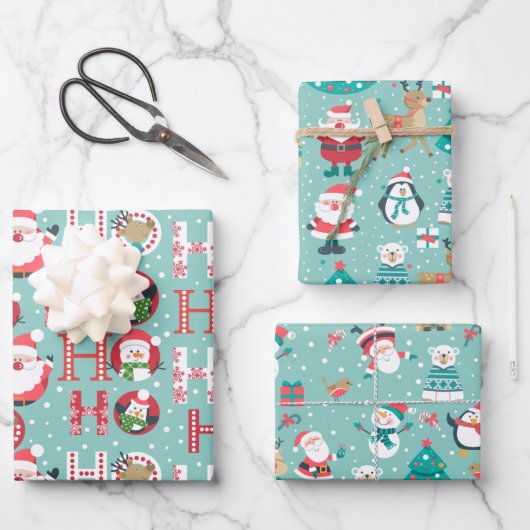 Weihnachtspinguine, Schneemänner, Weihnachtsmann a Geschenkpapier Set (Vorderseite)