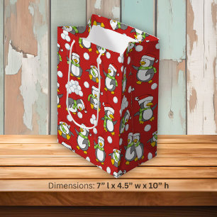 Weihnachtspinguinhintergrund Mittlere Geschenktüte