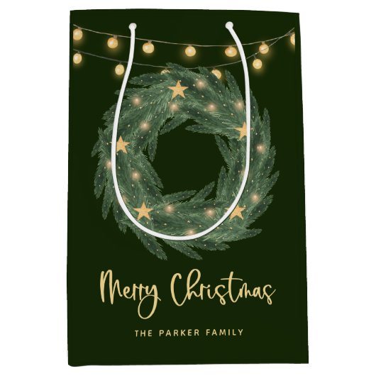 Weihnachtsreich mit goldenen String-Leuchten auf G Mittlere Geschenktüte (Vorderseite)