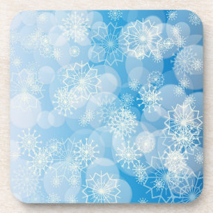 Weihnachtsschneeflocken auf blauem Hintergrund    Getränkeuntersetzer