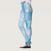 Weihnachtsschneeflocken auf blauem Hintergrund Leggings (Links)