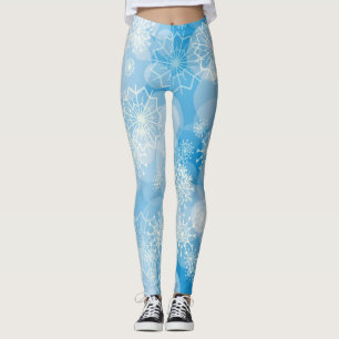 Weihnachtsschneeflocken auf blauem Hintergrund     Leggings