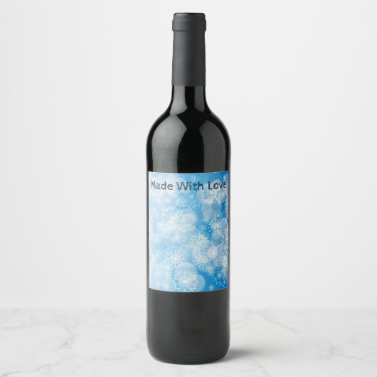 Weihnachtsschneeflocken auf blauem Hintergrund Weinetikett (Vorderseite)