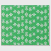 Weihnachtsschneeflocken auf Grün Geschenkpapier (Flach)