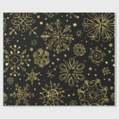 Weihnachtsschneeflocken aus Gold auf schwarz Geschenkpapier (Flach)