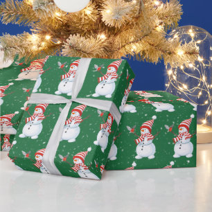 Weihnachtsschneemann mit Bird auf Green Geschenkpapier