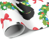 Weihnachtsschwarze Katze mit rotem Bogen Geschenkpapier (Rolleneckpunkt)