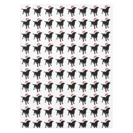 Weihnachtsschwarzer Labrador-Hund, der Tischdecke