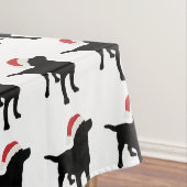 Weihnachtsschwarzer Labrador-Hund, der Tischdecke (Beispiel)