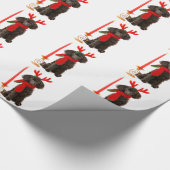 Weihnachtsschwarzer Zwergpudel-Hund gekleidet als Geschenkpapier (Ecke)