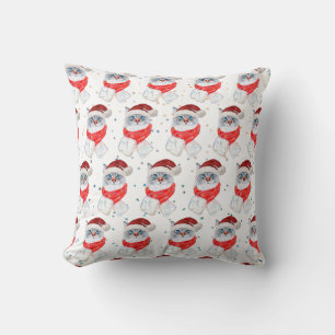 Weihnachtssilber und weiße Katze mit Weihnachtsman Kissen