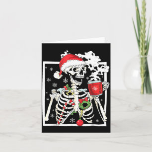 Weihnachtsskelett mit lächelndem Totenschädel beim Karte