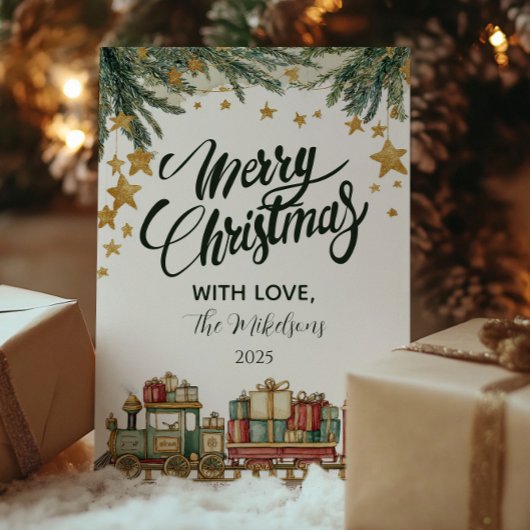 Weihnachtsspielzeugbahn unter dem Baum Feiertagskarte