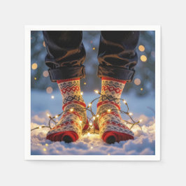 Weihnachtsstrümpfe und Feiertagslichter im Schnee Serviette