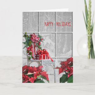 Weihnachtsstuhl mit Poinsettia im Fenster Karte