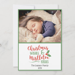 Weihnachtswünsche und Mistletoe Kisses Foto