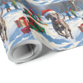 Weimaraner läuft im Schnee mit Weihnachtshut Geschenkpapier (Rolleneckpunkt)