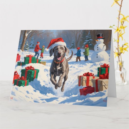 Weimaraner läuft im Schnee mit Weihnachtshut Karte (Gelbe Blume)