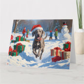 Weimaraner läuft im Schnee mit Weihnachtshut Karte (Vorderseite)