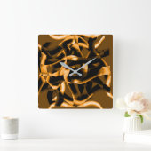 Weird tangle of burnt ribbons, black and orange quadratische wanduhr (Zuhause)