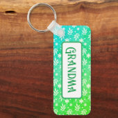 Weiße Blätter auf grünem Schlüsselanhänger (Vorderseite)