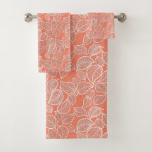 Weiße Blätter auf orangefarbenem Handtuch