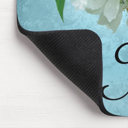 Weiße Blume auf blauer Mousepad (Ecke)